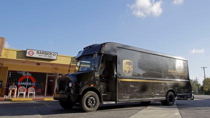  United Parcel Service Inc. says weak global trade and a disappointing holiday-shopping season slowed it down in the fourth quarter.